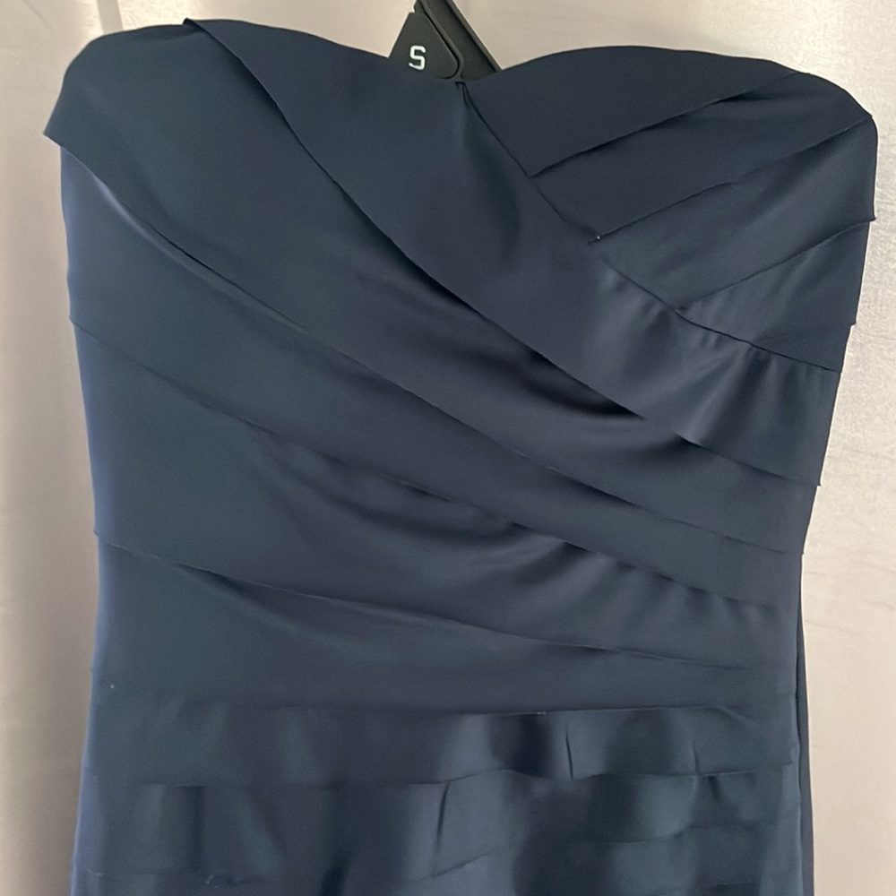 En Creme navy blue dress small strapless and has straps if you want tiers NWT